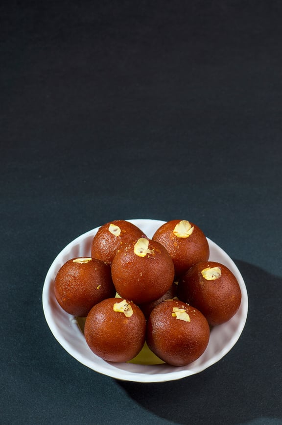 Gulab Jamun, Indian dessert topped with pistachio